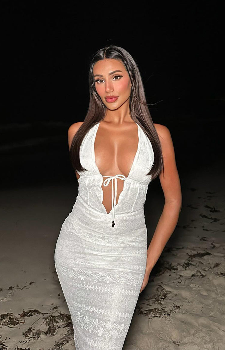 Close-up of the white lace halter maxi dress with deep V-neckline and tie-front bust detail