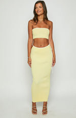 Yellow ribbed knit tube top with a strapless neckline and white contrast binding along the top and bottom edges