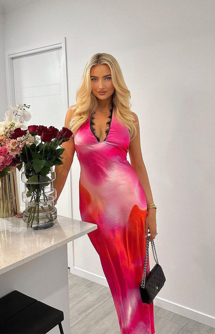 Pink and orange tie-dye print satin halter neck maxi dress with black lace trim and fitted silhouette