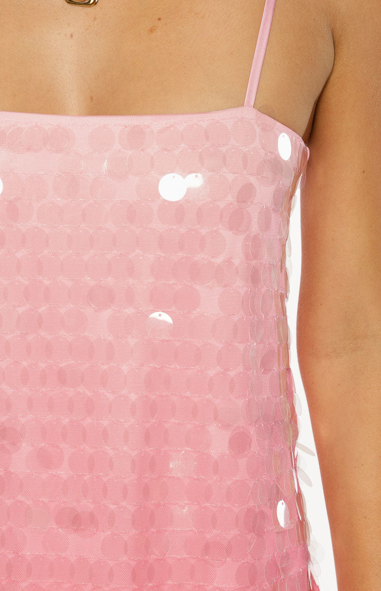 Close-up of the pink ombre sequin fabric with layered round sequins and a thin strap