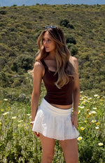 Side view of a fitted brown scoop neck tank top with wide shoulder straps