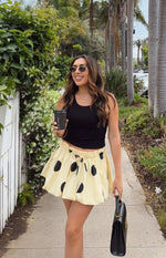 Beginning Boutique Henrietta Yellow Polka Dot Bubble Hem Mini Skirt light yellow black polka dot bubble hem mini skirt with a