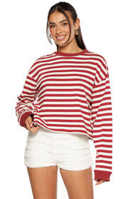 Burgundy and white striped long sleeve top with a relaxed, cropped fit, crew neck, and ribbed cuffs