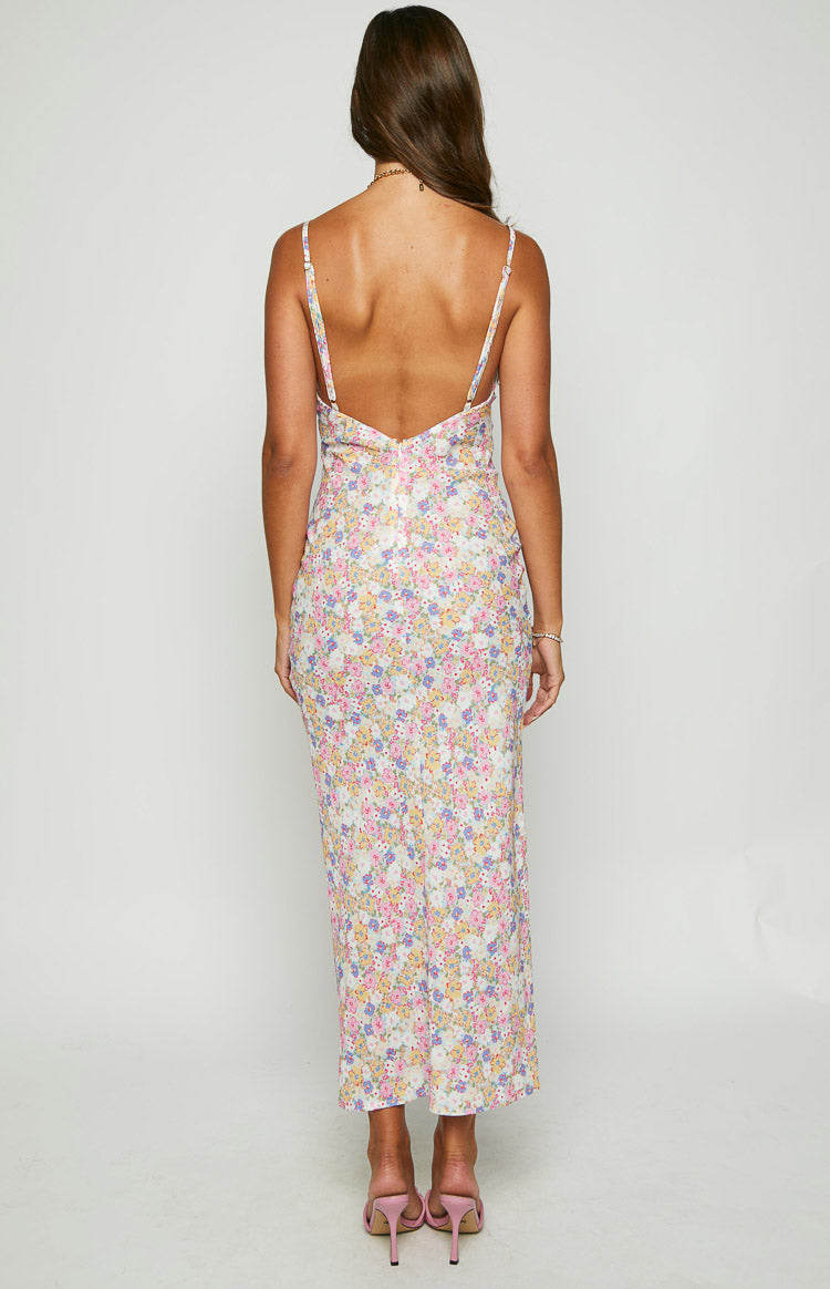 Rear view of a white floral maxi dress with a low scoop back and thin spaghetti straps