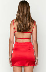Rear view of a red satin fitted mini dress with thin spaghetti straps and two horizontal elasticated back straps