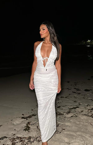 Beginning Boutique Novalie White Lace Halter Maxi Dress white lace halter maxi dress with deep V-neck tie-front and ruched bodycon fit